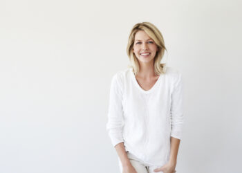 Blond and beautiful woman in white fashion